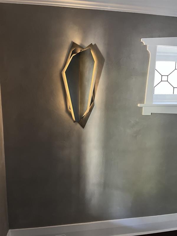 Illuminated architectural wall light