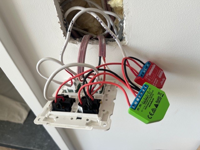 Shelly smart modules installed behind a wall switch